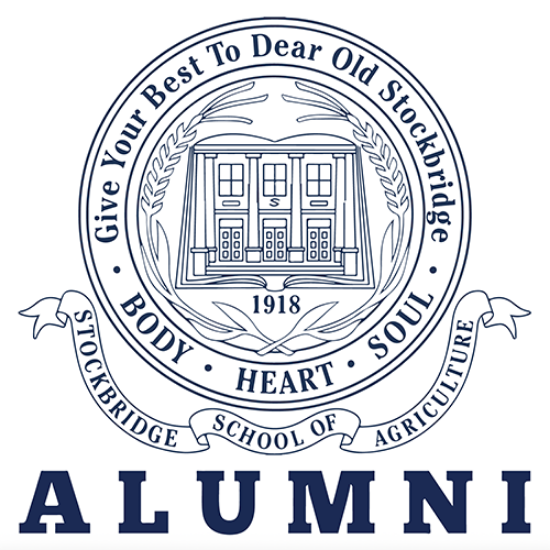 Decorative seal, with "ALUMNI" in large block letters below seal.